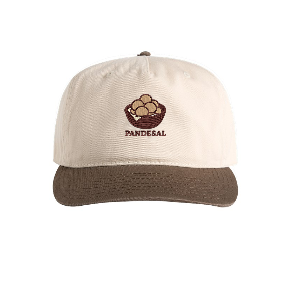Front view of a cream and brown two-tone cap with embroidered basket of pandesal and "PANDESAL" text.