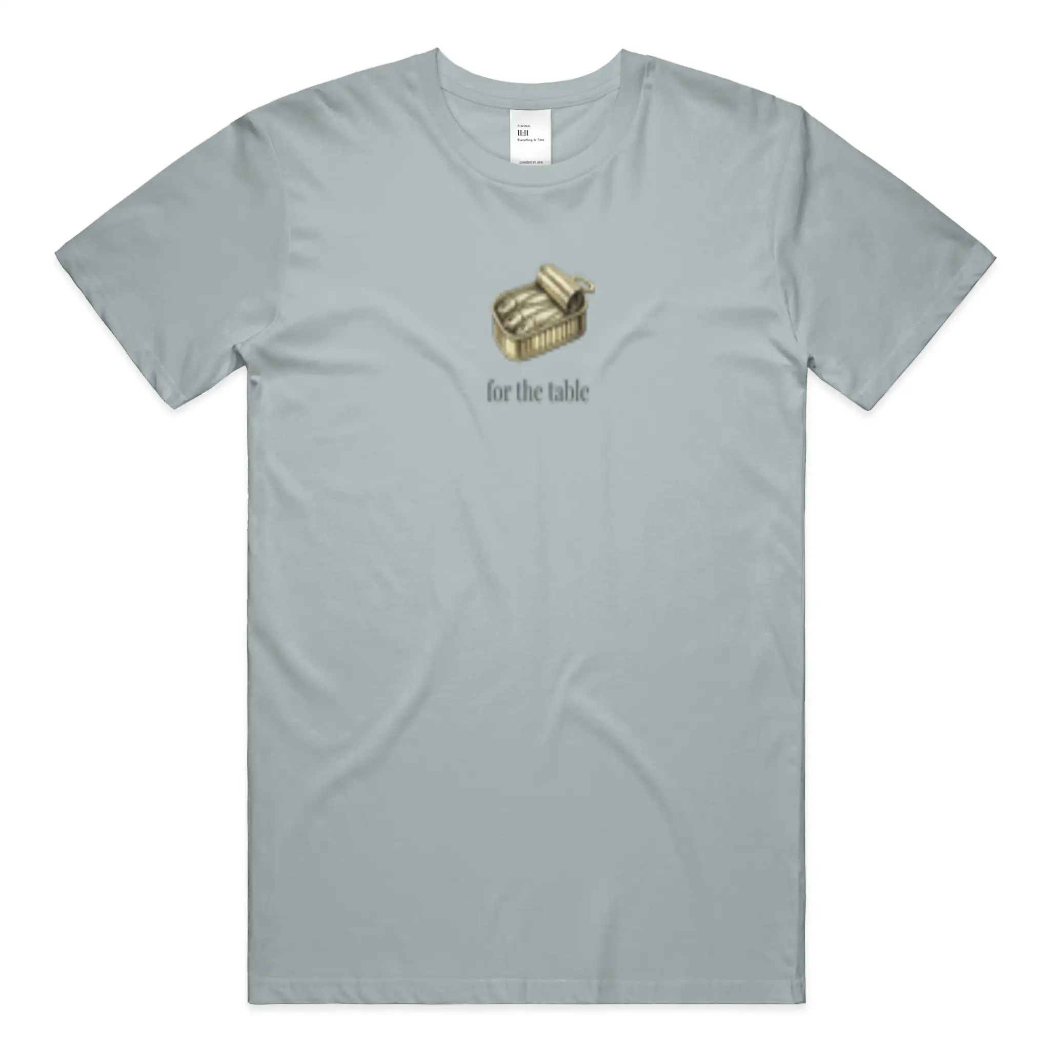 Front view of the For the Table t-shirt in Sea Glass featuring a sardine tin chest graphic