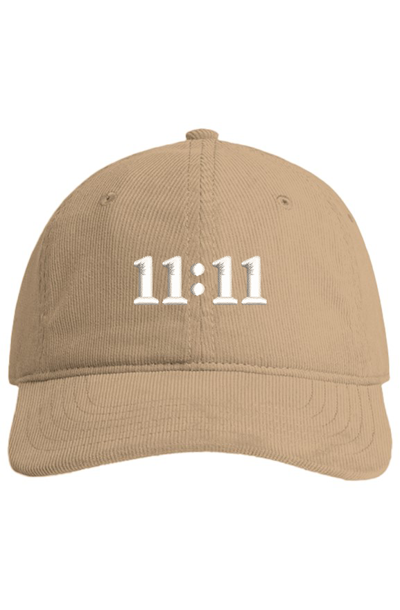 Front view of a beige corduroy hat featuring white 11:11 embroidery.