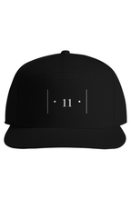 front view of a black cap with white embroidered Passage Mark featuring vertical bars, dots, and the number 11