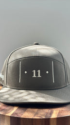 Front view of The Passage Mark™ structured cap in Rooted featuring the embroidered │ • 11 • │ symbol in white thread