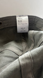 Inside view of a vintage washed gray dad hat with the Timing 11:11 woven label.